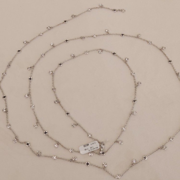 Collana Modello T con 46 Diamanti ct 1,32 F VS e n° 18 diamanti neri ct 0,70 misura 80 cm Oro bianco 18 kt 12,55 gr